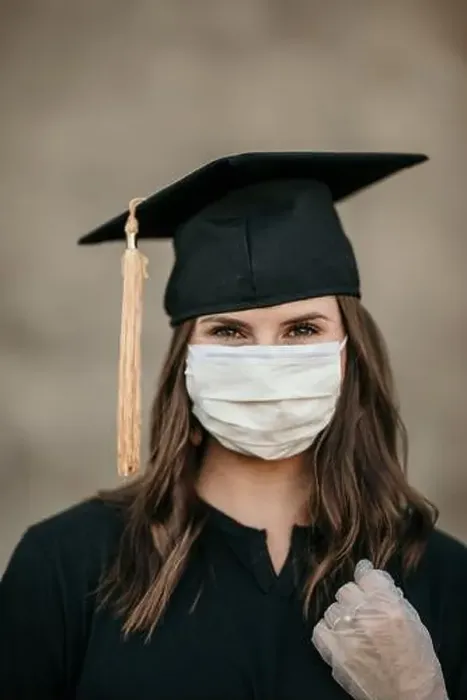Framed Print : Girl graduate in graduation cap and covid 19 mask Framed Print : Girl graduate in graduation cap and covid 19 mask