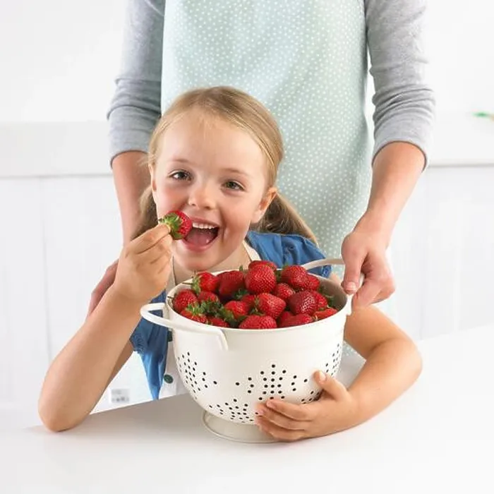 Framed Print : Girl and large colander of strawberries, 5 years Framed Print : Girl and large colander of strawberries, 5 years
