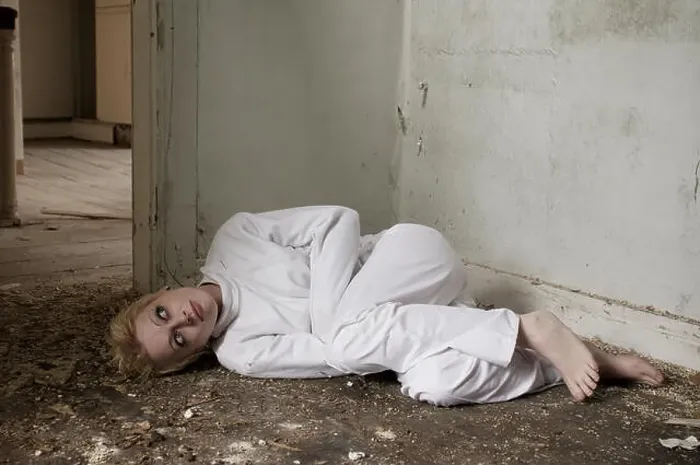 Framed Print : Girl in a straight-jacket inside an abandoned house Framed Print : Girl in a straight-jacket inside an abandoned house
