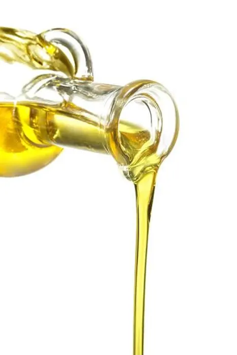 Framed Print : glass bottle pouring oil isolated on white Framed Print : glass bottle pouring oil isolated on white
