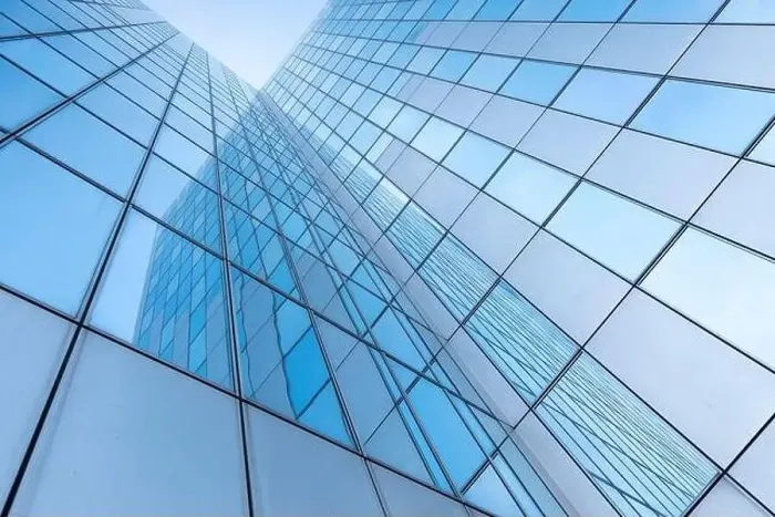 Framed Print : glass facades of modern office buildings and reflection of blue sky Framed Print : glass facades of modern office buildings and reflection of blue sky