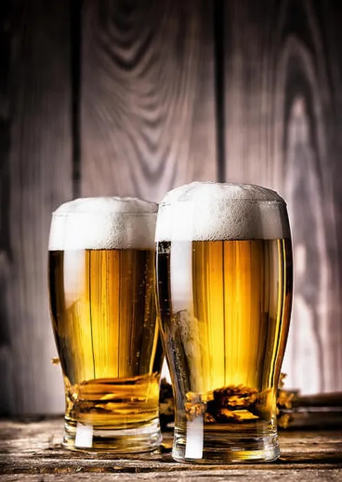 Framed Print : Two glasses of light beer with foam on a wooden background Framed Print : Two glasses of light beer with foam on a wooden background