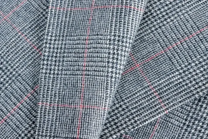 Framed Print : Glen plaid or Glenurquhart check a woolen fabric with a woven twill design of small and large checks used in suits Framed Print : Glen plaid or Glenurquhart check a woolen fabric with a woven twill design of small and large checks used in suits