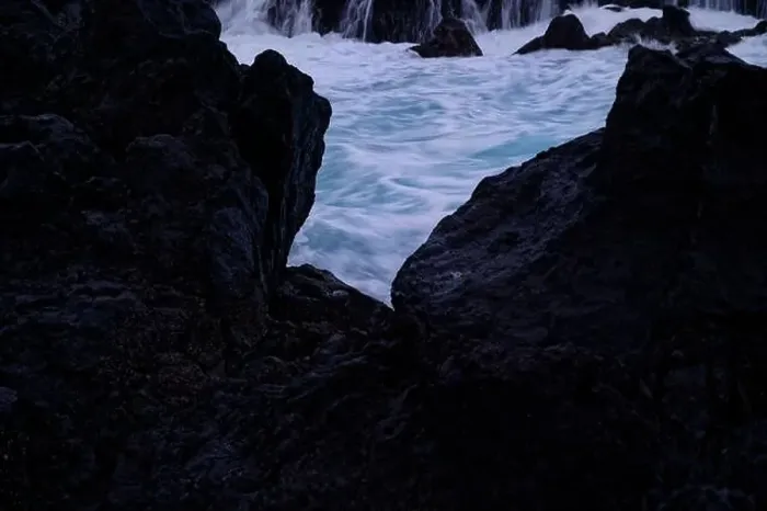 Framed Print : A glimpse of swirling ocean waters framed by dark volcanic rocks at Porto Moniz natural pools Framed Print : A glimpse of swirling ocean waters framed by dark volcanic rocks at Porto Moniz natural pools