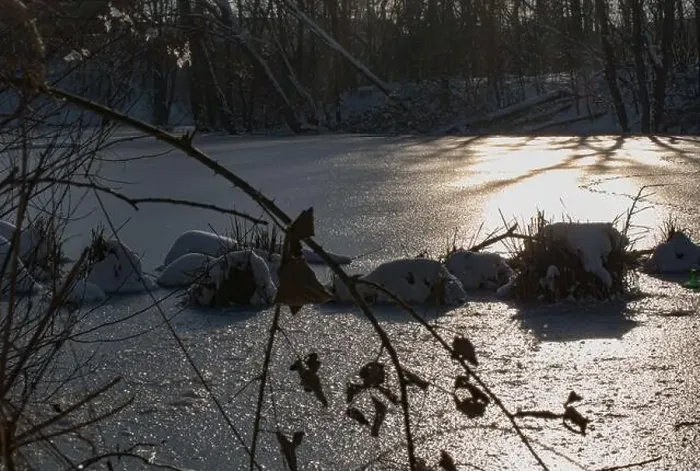 Framed Print : Glittering of the evening sun on the ice surface of a frozen lake Framed Print : Glittering of the evening sun on the ice surface of a frozen lake