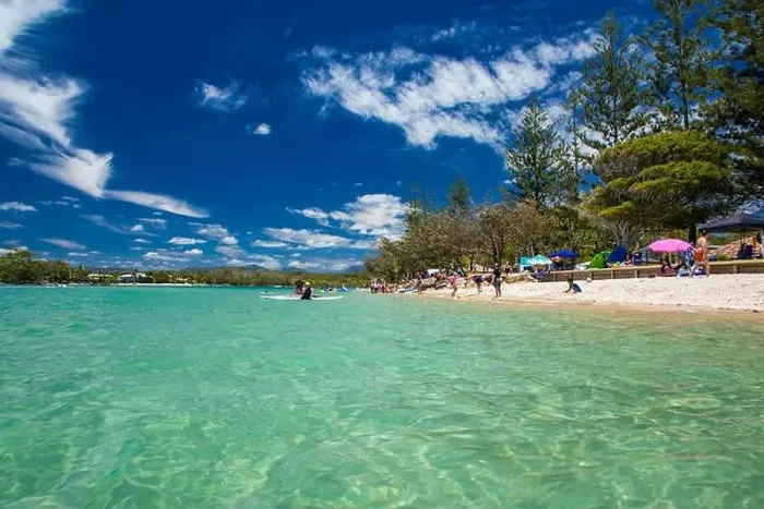 Framed Print : Gold Coast, AUS - JAN 12 2019: People enjoying beach activities at famous family beach at Tallebudgera Creek Gold Coast