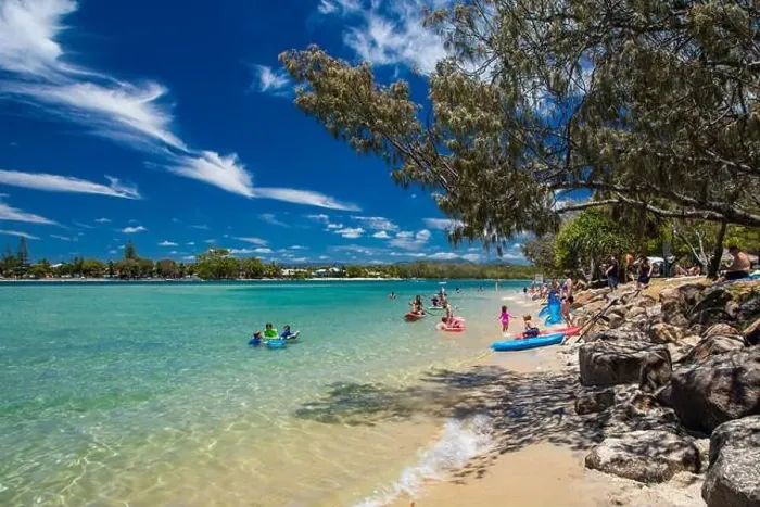 Framed Print : Gold Coast, AUS - JAN 12 2019: People enjoying beach activities at famous family beach at Tallebudgera Creek Gold Coast