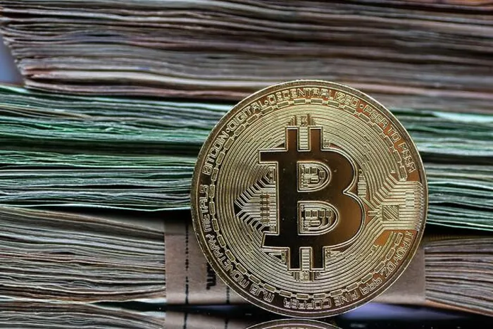 Framed Print : Golden Bitcoin coins are arranged alongside a pile of Euro notes Framed Print : Golden Bitcoin coins are arranged alongside a pile of Euro notes