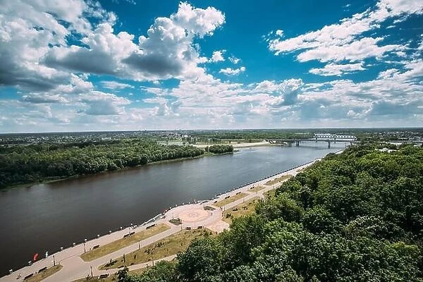 Gomel, Belarus. Top Aerial View Of Promenade Near Sozh River In City Park At Summer Sunny Day. Blue Sky With Clouds