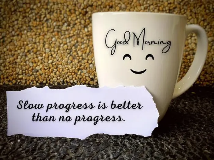 Framed Print : Good morning text on a coffee cup with motivational quote on a piece of paper - slow progress is better than no Framed Print : Good morning text on a coffee cup with motivational quote on a piece of paper - slow progress is better than no