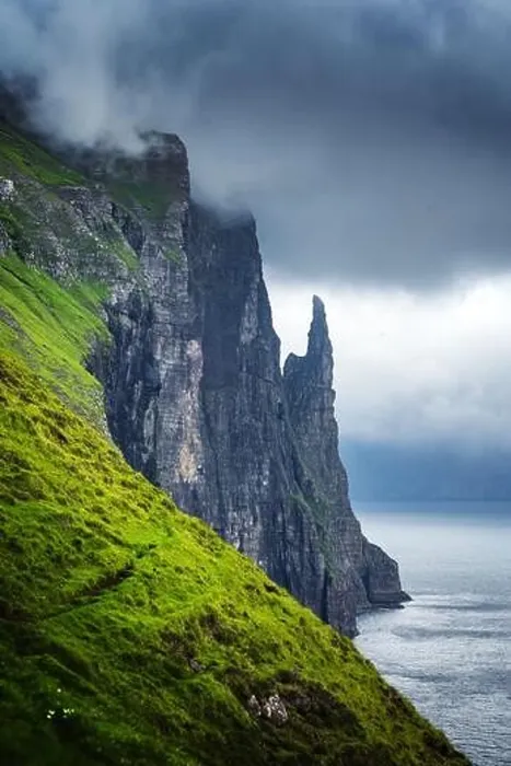 Framed Print : Gorgeous faroese landscape with famous Witches Finger cliffs and dramatic cloudy sky from Trollkonufingur viewpoint Framed Print : Gorgeous faroese landscape with famous Witches Finger cliffs and dramatic cloudy sky from Trollkonufingur viewpoint