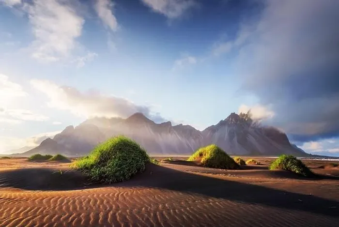 Framed Print : Gorgeous landscape with black sand desert dunes and grassy bumps near famous Stokksnes mountains on Vestrahorn cape, Iceland Framed Print : Gorgeous landscape with black sand desert dunes and grassy bumps near famous Stokksnes mountains on Vestrahorn cape, Iceland