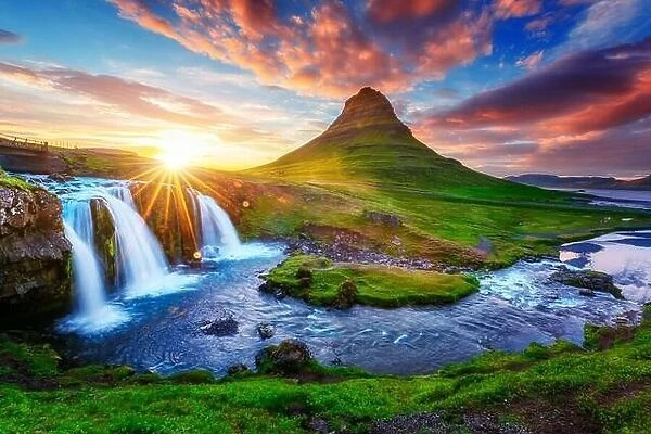 Gorgeous landscape with rising sun on Kirkjufellsfoss waterfall and Kirkjufell mountain, Iceland, Europe