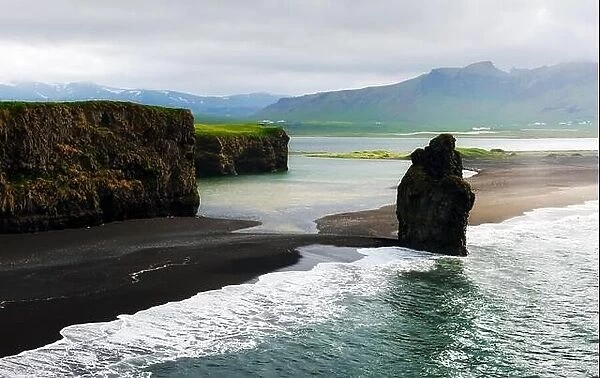 Gorgeous landscape with rocks and Atlantic ocean from southern coast of Iceland. Black beach, Reynisdrangar, Vik