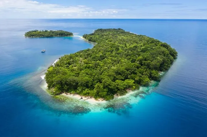 Framed Print : A gorgeous, tropical island is surrounded by reef in Papua New Guinea. This remote area is part of the Coral Triangle due to its marine biodiversity Framed Print : A gorgeous, tropical island is surrounded by reef in Papua New Guinea. This remote area is part of the Coral Triangle due to its marine biodiversity
