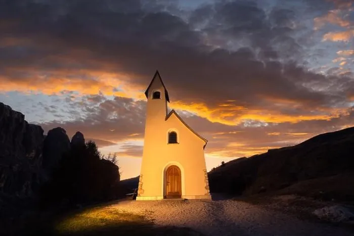 Framed Print : Gorgeus view on small iIlluminated chapel - Kapelle Ciapela on Gardena Pass, Italian Dolomites mountains. Golden sunset light on background Framed Print : Gorgeus view on small iIlluminated chapel - Kapelle Ciapela on Gardena Pass, Italian Dolomites mountains. Golden sunset light on background