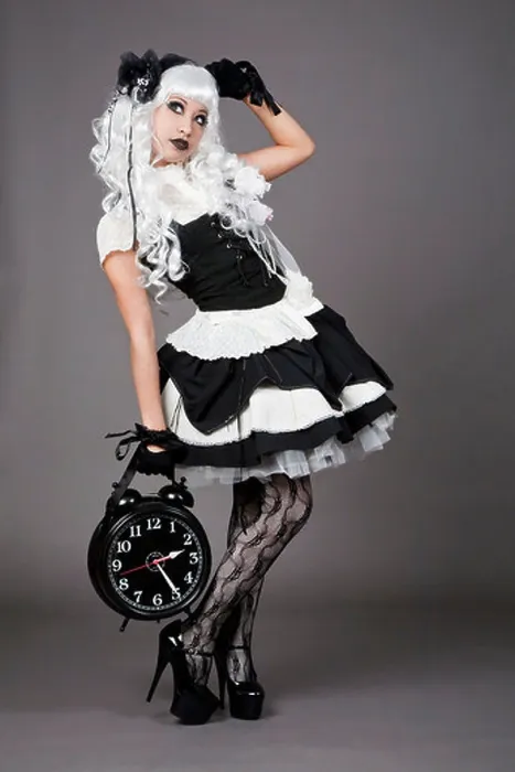 Framed Print : Gothic dressed teenager holding an alarm clock Framed Print : Gothic dressed teenager holding an alarm clock
