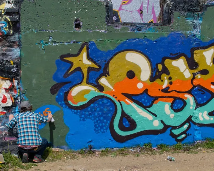 Framed Print : Graffiti artist at work on a wall in Brighton Framed Print : Graffiti artist at work on a wall in Brighton