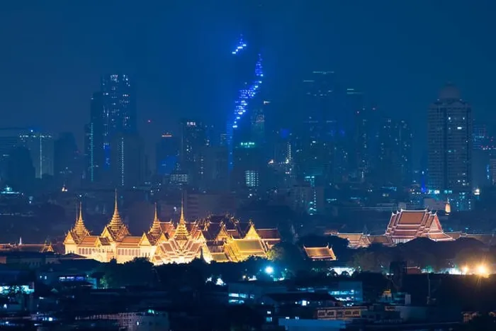 Framed Print : Grand palace bangkok with bangkok city skyscrapers at night in Bangkok, Thailand Framed Print : Grand palace bangkok with bangkok city skyscrapers at night in Bangkok, Thailand