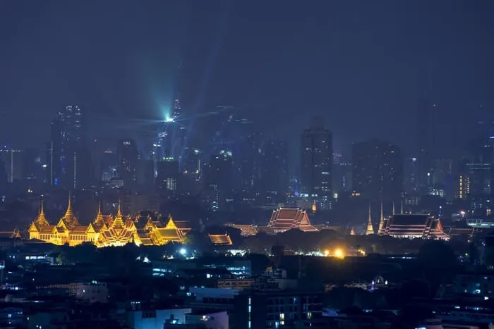 Framed Print : Grand palace with Bangkok city skyscrapers at night in Bangkok, Thailand Framed Print : Grand palace with Bangkok city skyscrapers at night in Bangkok, Thailand