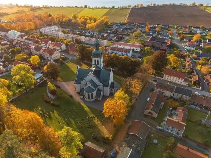 Framed Print : Gränna church in Sweden, autumn colors, at sunset, aerial view. Beautiful small swedish town Framed Print : Gränna church in Sweden, autumn colors, at sunset, aerial view. Beautiful small swedish town