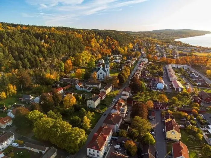 Framed Print : Gränna church in Sweden, autumn colors, at sunset, aerial view. Beautiful small swedish town Framed Print : Gränna church in Sweden, autumn colors, at sunset, aerial view. Beautiful small swedish town