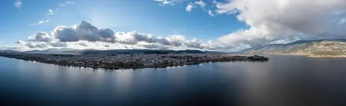 Framed Print : Greece, Ioannina city. Aerial panoramic drone view of Giannena and Lake Pamvotis, cloudy blue sky. Epirus Framed Print : Greece, Ioannina city. Aerial panoramic drone view of Giannena and Lake Pamvotis, cloudy blue sky. Epirus