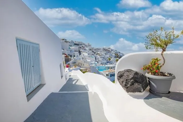Framed Print : Greek island of Santorini. Amazing travel panorama, white houses, stairs and flowers on the streets. Idyllic summer vacation, urban landscape, tourism
