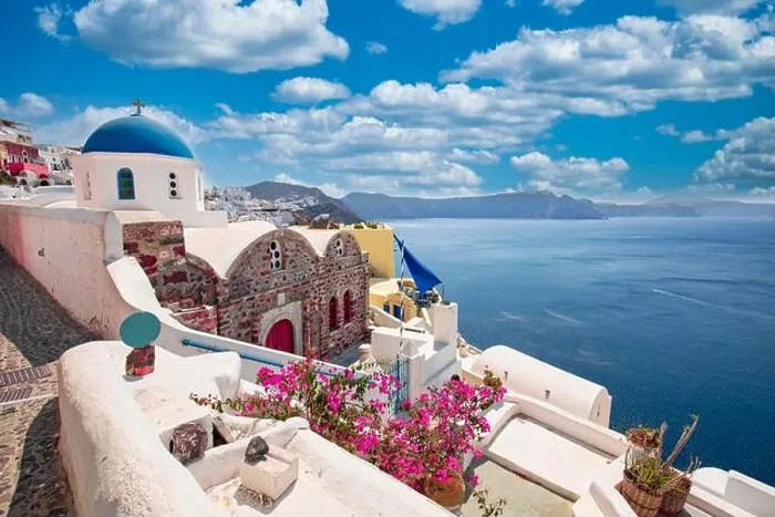 Framed Print : Greek island of Santorini. Amazing travel panorama, white houses, stairs and flowers on the streets. Idyllic summer vacation, urban landscape, tourism Framed Print : Greek island of Santorini. Amazing travel panorama, white houses, stairs and flowers on the streets. Idyllic summer vacation, urban landscape, tourism
