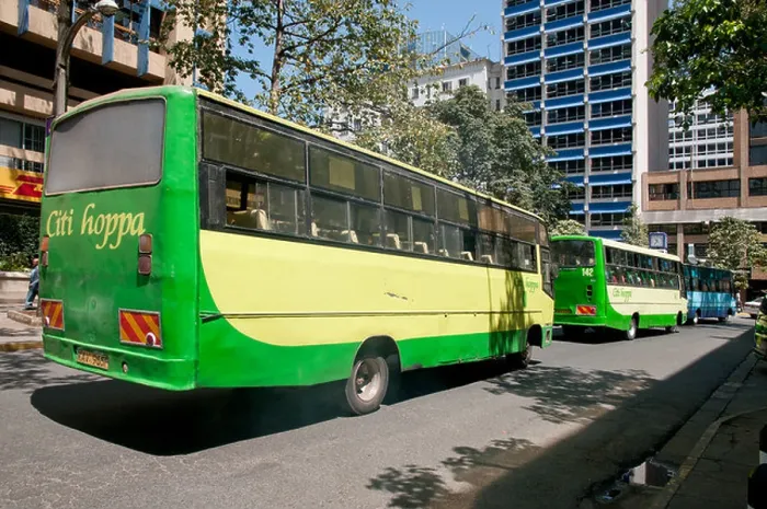 Framed Print : Two green Citi Hoppa Buses and blue KBS Kenya Bus Service bus on Simba Street in central Nairobi Kenya Framed Print : Two green Citi Hoppa Buses and blue KBS Kenya Bus Service bus on Simba Street in central Nairobi Kenya