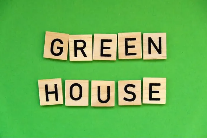 Framed Print : Green house text on wooden blocks on green background. Ecological concept Sustainable responsible living. Copy space Framed Print : Green house text on wooden blocks on green background. Ecological concept Sustainable responsible living. Copy space