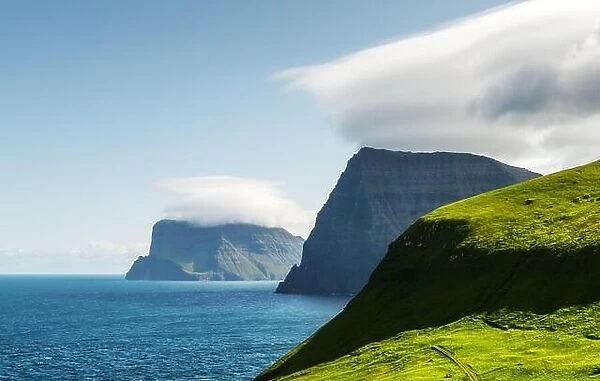 Green summer Islands in Atlantic ocean from Kalsoy island, Faroe Islands, Denmark. Landscape photography