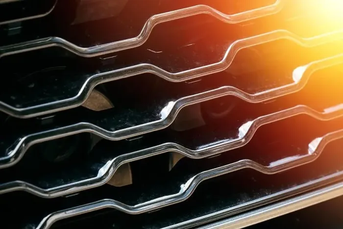 Framed Print : Grid of car with sunflare. Radiator grille. Metal close-up texture background. Chrome grill of big powerful engine macro Framed Print : Grid of car with sunflare. Radiator grille. Metal close-up texture background. Chrome grill of big powerful engine macro