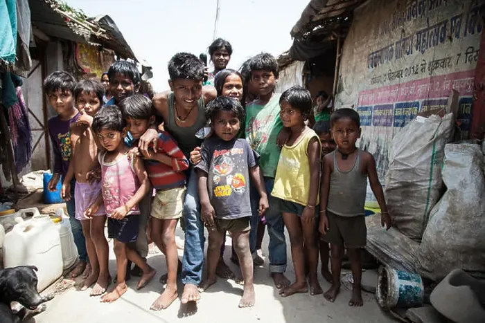 Framed Print : Group of children in the slum at the Ghazipur garbage dump, New Delhi, India Framed Print : Group of children in the slum at the Ghazipur garbage dump, New Delhi, India