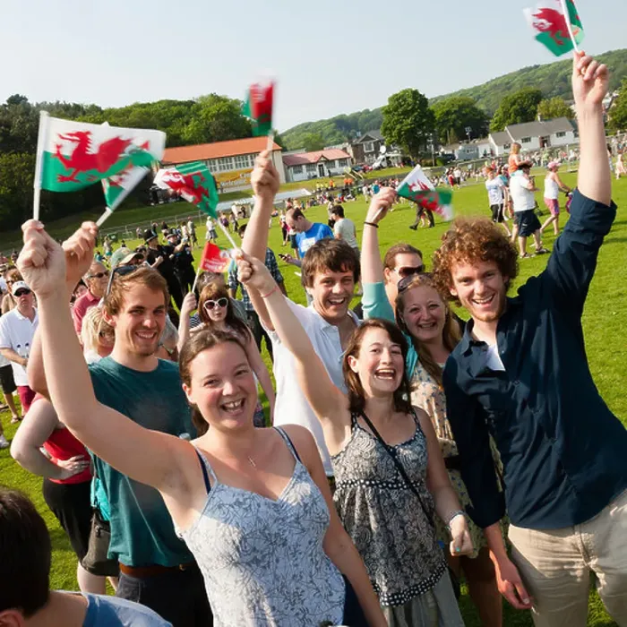 Framed Print : a group of happy laughing young people waving welsh banners flags, wales Framed Print : a group of happy laughing young people waving welsh banners flags, wales