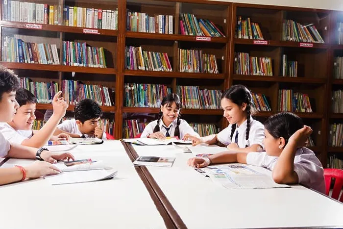 Framed Print : Group Indian School Students Books Studying In Library Framed Print : Group Indian School Students Books Studying In Library