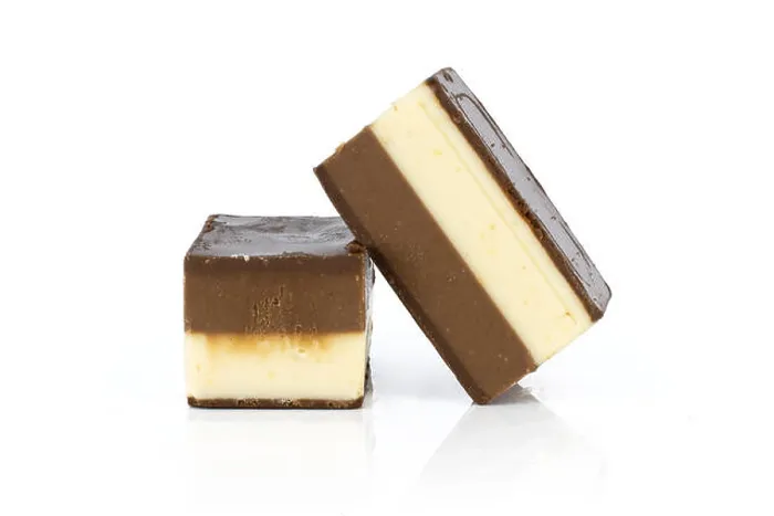 Framed Print : Group of two whole mellow two coloured nougat piece bars isolated on white background Framed Print : Group of two whole mellow two coloured nougat piece bars isolated on white background