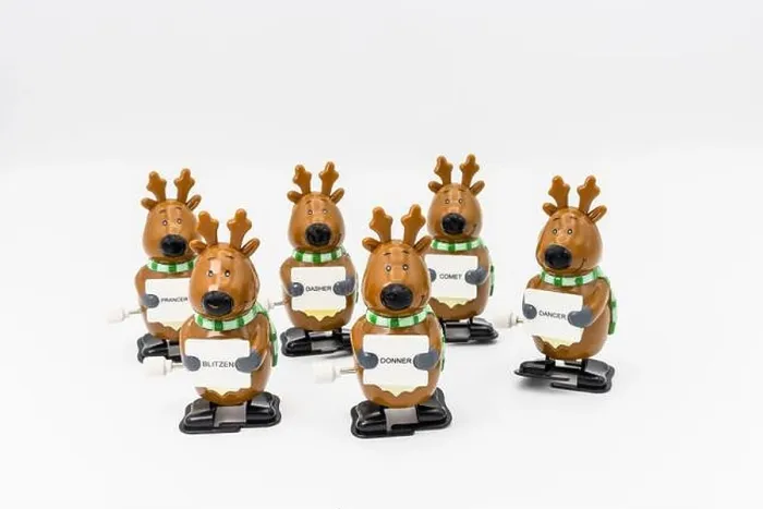 Framed Print : Group of six novelty plastic wind-up models of Santa's reindeer holding signs with their names Framed Print : Group of six novelty plastic wind-up models of Santa's reindeer holding signs with their names