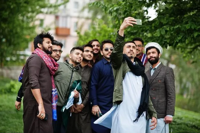 Framed Print : Group of pakistani man wearing traditional clothes salwar kameez or kurta making selfie on mobile phone Framed Print : Group of pakistani man wearing traditional clothes salwar kameez or kurta making selfie on mobile phone