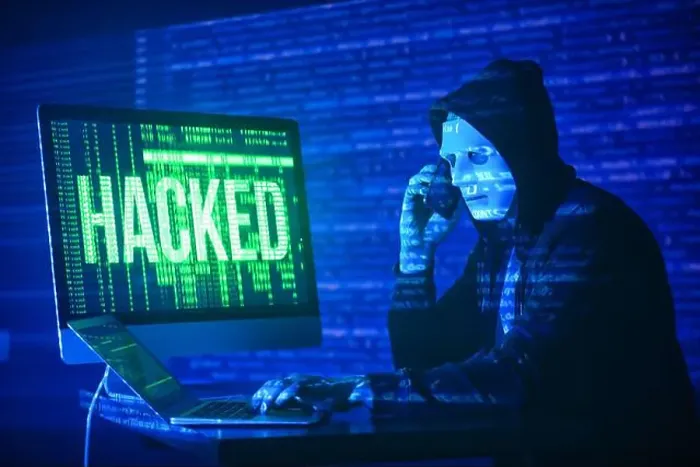 Framed Print : Hacker with mobile phone using computer in dark room Framed Print : Hacker with mobile phone using computer in dark room