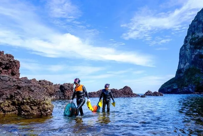 Framed Print : Haenyeo women, famous for diving into their eighties and holding their breath for up to two minutes, diving for conch, octopus, seaweed, and other sea