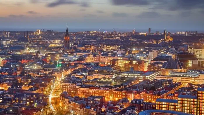 Framed Print : The Hague, Netherlands cityscape with landmark towers in the distance at dusk Framed Print : The Hague, Netherlands cityscape with landmark towers in the distance at dusk