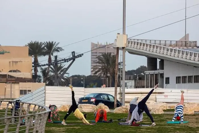 Framed Print : Haifa, Israel - March 1, 2023, Promenade along the sea. Women do yoga and sports near the beach in Haifa Framed Print : Haifa, Israel - March 1, 2023, Promenade along the sea. Women do yoga and sports near the beach in Haifa