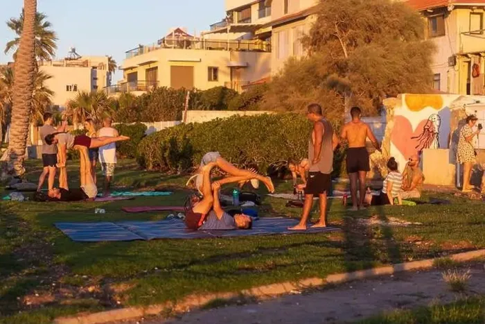 Framed Print : Haifa, Israel - March 1, 2023, Promenade along the sea. Women and men do yoga and sports near the beach in Haifa Framed Print : Haifa, Israel - March 1, 2023, Promenade along the sea. Women and men do yoga and sports near the beach in Haifa