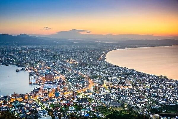Hakodate, Hokkaido, Japan city skyline from Mt. Hakodate at dawn. The view is considered one of the three best in Japan