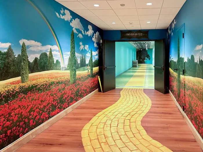 Framed Print : Hallway with yellow brick road, rainbow, and flower scene at Epic Systems on August 4, 2023 in Verona, Wisconsin, USA Framed Print : Hallway with yellow brick road, rainbow, and flower scene at Epic Systems on August 4, 2023 in Verona, Wisconsin, USA