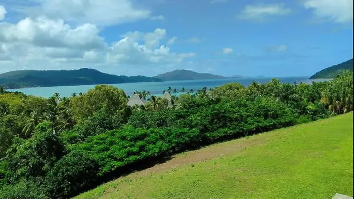 Framed Print : Hamilton Island panorama: lush green hills roll down to a turquoise ocean, creating a picture-perfect tropical paradise Framed Print : Hamilton Island panorama: lush green hills roll down to a turquoise ocean, creating a picture-perfect tropical paradise