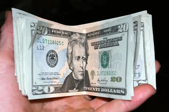 Framed Print : Hand holding USA twenty dollar bills on black Framed Print : Hand holding USA twenty dollar bills on black