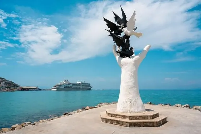 Framed Print : Hand of Peace Sculpture and cruise ship behind it in Kusadasi Aydin
