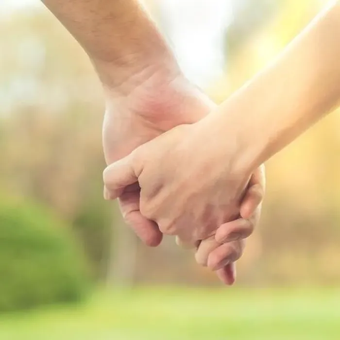 Framed Print : Two hands together, a man and a woman holding hands. Husband and wife together. Support and understanding